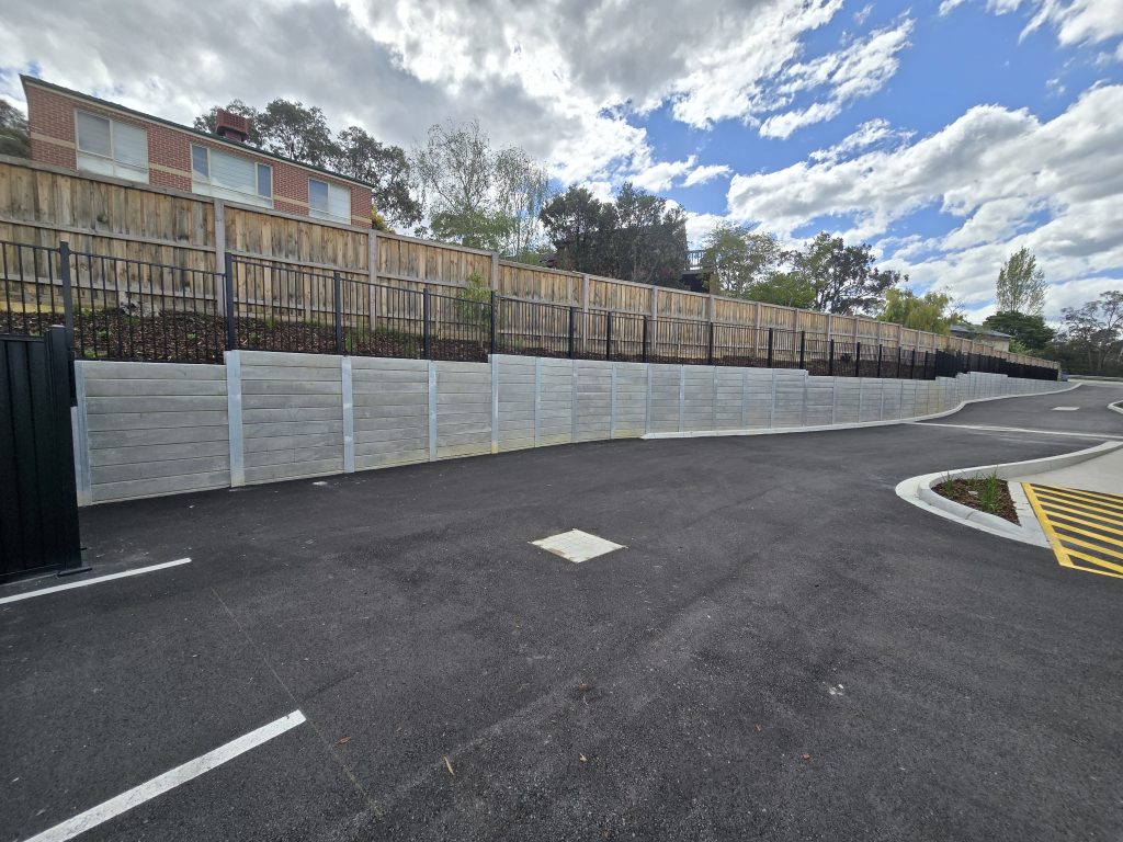 Venald concrete sleeper retaining walls and steel fencing at Heathmont