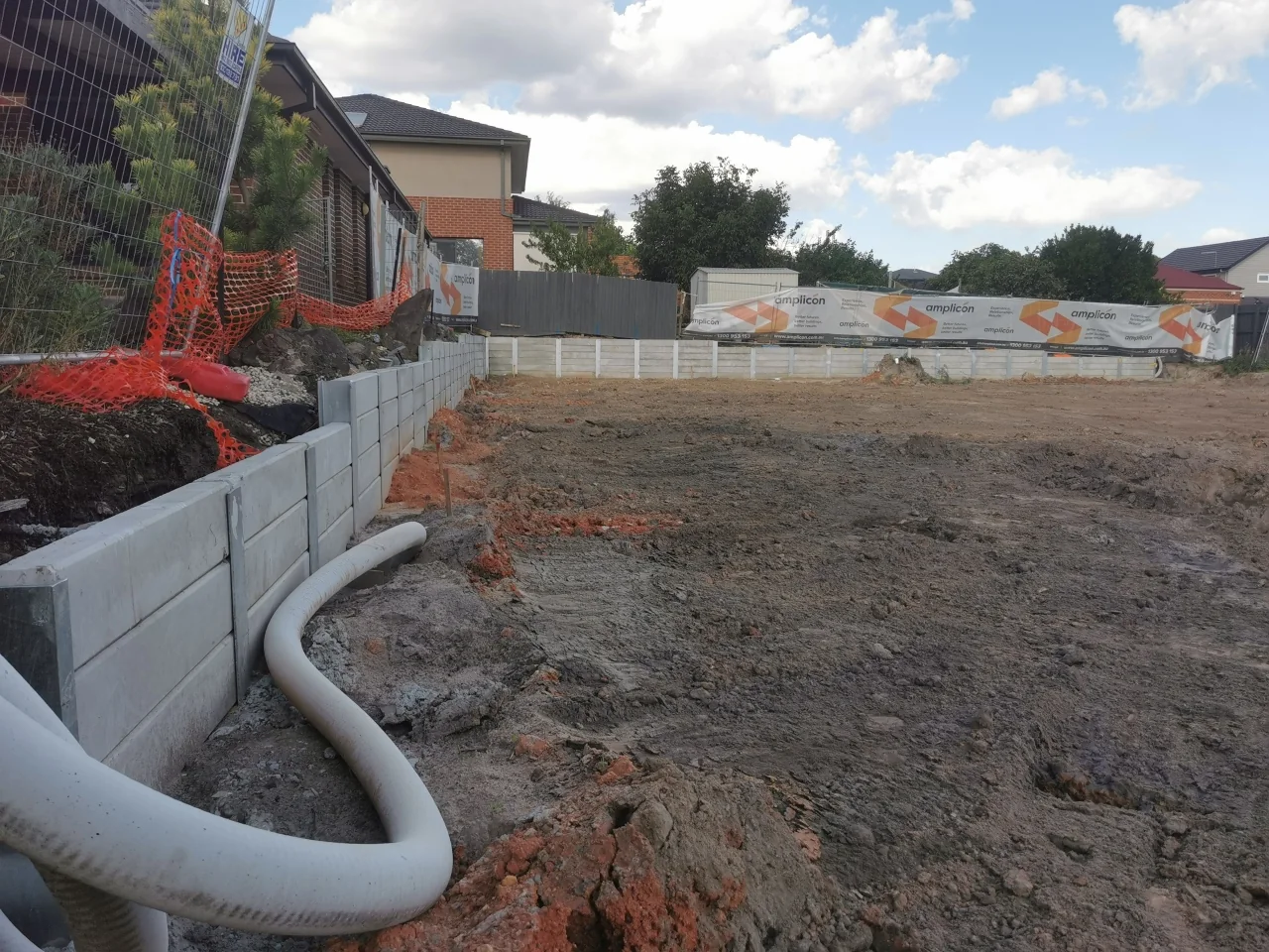 Concrete sleeper retaining walls around the Huntingdale apartment construction site for Amplicon