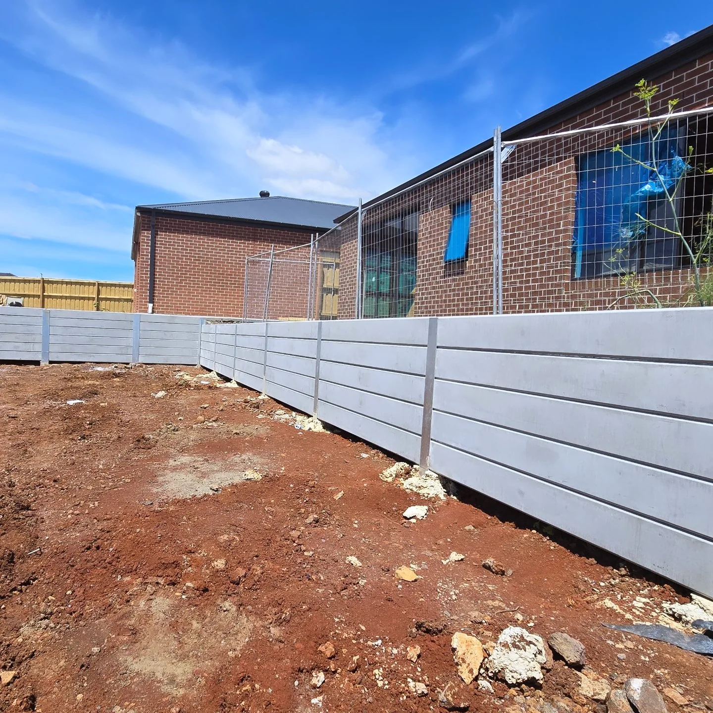 Concrete sleeper retaining wall turning a corner at Rockbank Childcare Centre